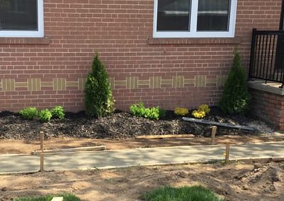 Walkway with stakes and soil