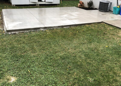 Smooth concrete pad in backyard after pour