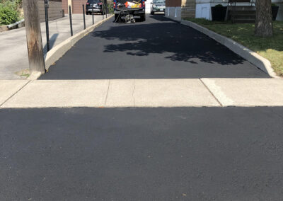 Smooth black driveway after sealing